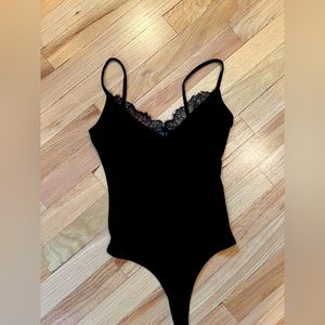 Nordstrom black bodysuit tank top with lace trim.